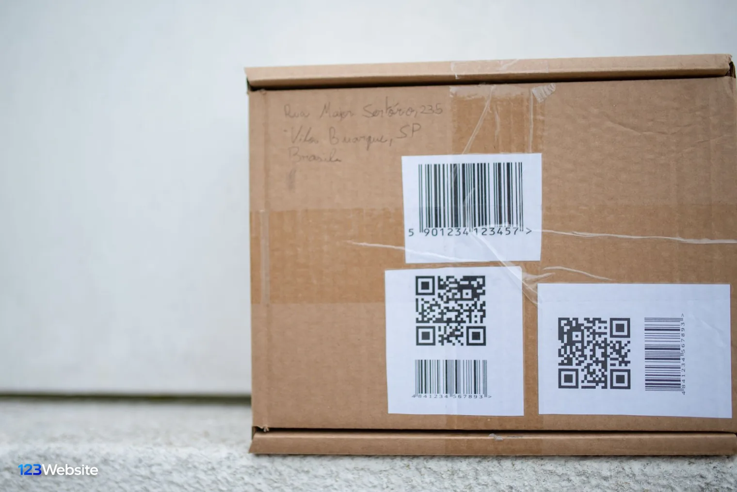 Barcode and SKU labels on a carton before syncing with Shopify