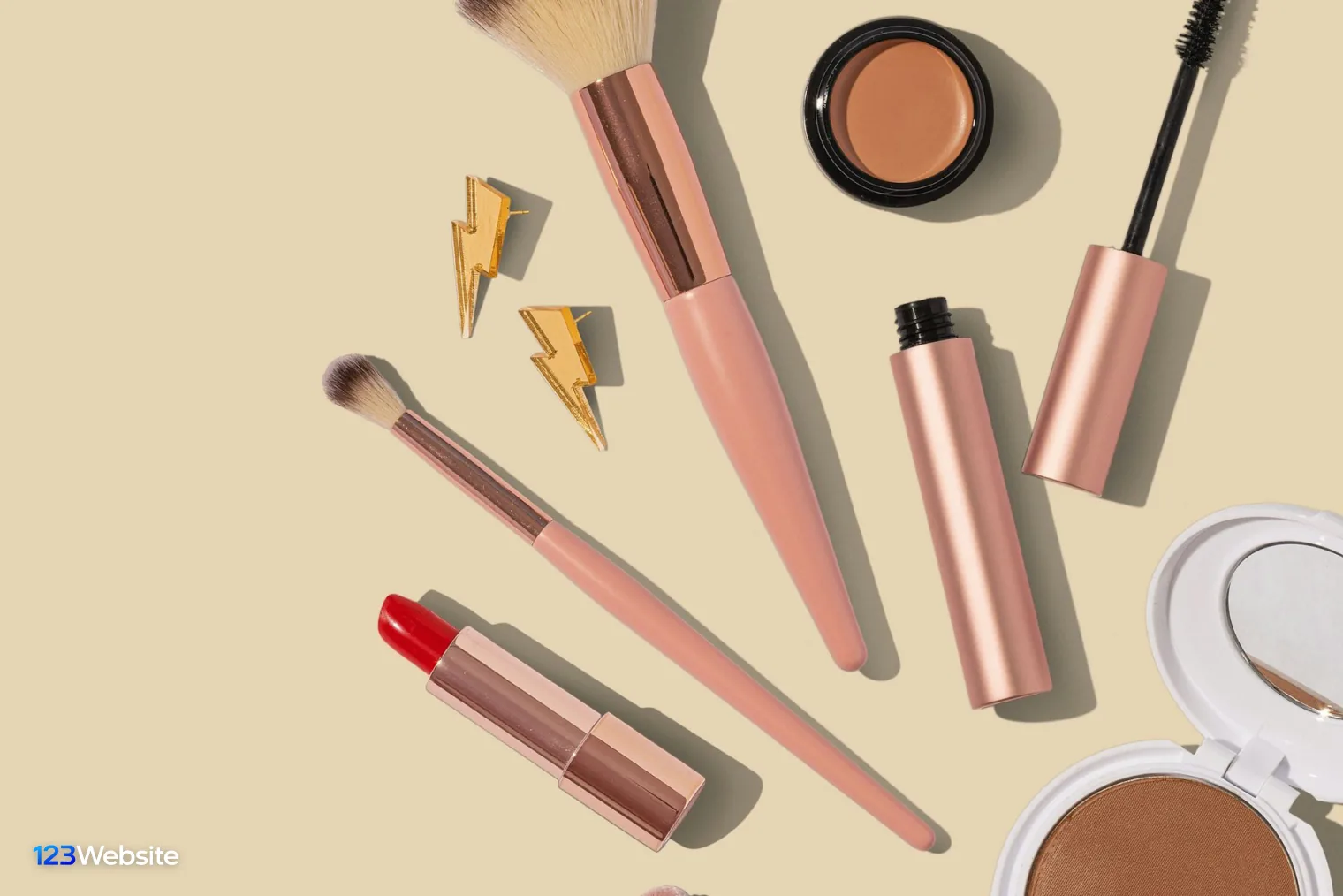Lipstick and powder laid out for cosmetics product photos on a Shopify store